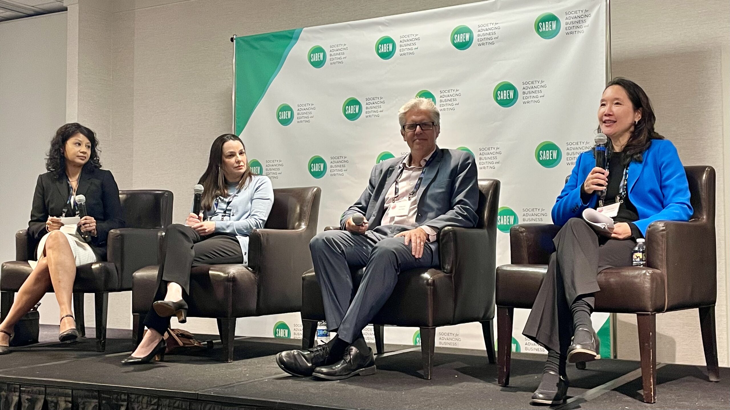 Jenny Yang (right) speaks at the Society for Advancing Business Editing and Writing annual conference.